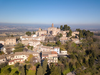Naklejka premium Italy, December 2021- aerial view of the medieval village of Montemaggiore al Metauro in the province of Pesaro and Urbino in the Marche region