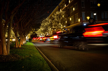 Fototapeta na wymiar Busy urban street beautifully illuminated for Christmas