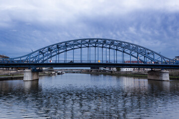 Fototapeta na wymiar The Jozef Piłsudski Bridge is a bridge over the Vistula in Krakow, Poland