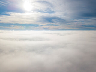 Naklejka na ściany i meble High flight over the fog. Aerial drone view.