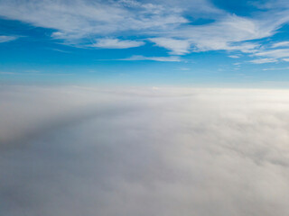 Fototapeta na wymiar High flight over the fog. Aerial drone view.