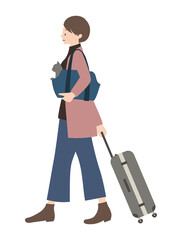 キャリーバッグに入れた猫と、スーツケースを運んでいる女性（帰省やペット旅行等のイメージに）