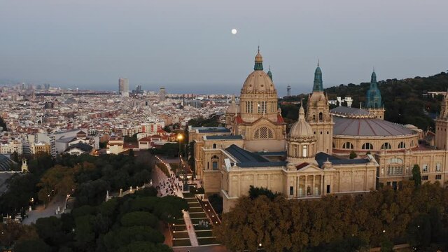 BARCELONA, CATALONIA, SPAIN - NOVEMBER 2021: Aerial view of National Art Museum of Catalonia. People gathering at entrance to take part in event