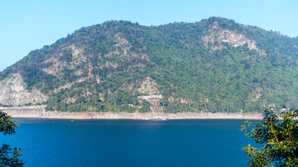 Bhakra Dam is a concrete gravity dam on the Sutlej River in Bilaspur, Himachal Pradesh in northern India. The dam forms the Gobind Sagar reservoir.