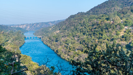 Fototapeta na wymiar Bhakra Dam is a concrete gravity dam on the Sutlej River in Bilaspur, Himachal Pradesh in northern India. The dam forms the Gobind Sagar reservoir.