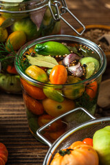 Homemade Preserves. PIckled Tomatoes. Conserve Food in Jar