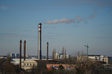 The chimney of a thermal power plant, the smoke extracted by a thermal power plant on the chimney, in the production process. Environment. Pollution.