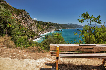 Seascape with waves crashing onto rocks. Corfu island, Greece.