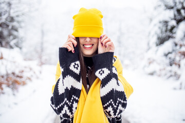 Portrait of pretty happy woman at winter outdoor