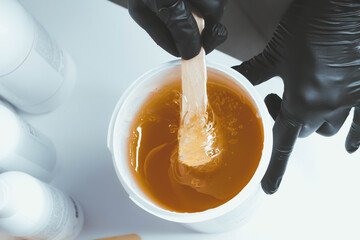 Shugaring master. Sugar paste for depilation. Intimate hygiene. Smooth skin.