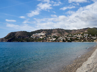 La Herradura beach and bay. A gravel beach in the Mediterranean. Almuñécar,  province of Granada, Andalusia, Tropical Coast, Spain
