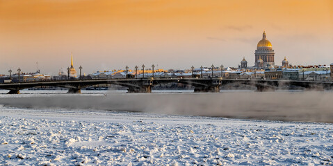 Winter panoramic view of St. Petersburg at sunset, Isaac cathedral and Blagoveshenskiy bridge on...