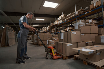 Serious male person standing near rockle cart