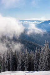 Giumalau Mountains - Romania seen through the fog in winter
