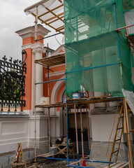 Restoration work outside the church, scaffolding, church in the background