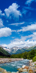 View of the mountain river in the gorge, North Ossetia, Russia. Impenetrable rocks, majestic sun,...