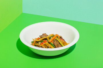 Grilled Beef Steak salad with vegetables on green backgound