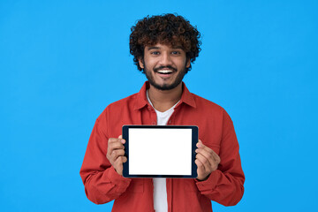 Happy young indian man showing tablet computer big mockup white blank empty template screen...