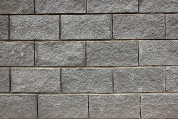 Old dry grey brick wall background texture