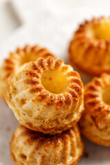 Close-up Muffins with oranges on white board, marco and texture. Cupcakes