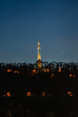 Illuminated Petrin Lookout Tower,Prague,Czech republic.Steel tower 63.5 metres tall on Petrin Hill built in 1891.Observation transmission tower.Major tourist attraction in Czech capital.Night lights