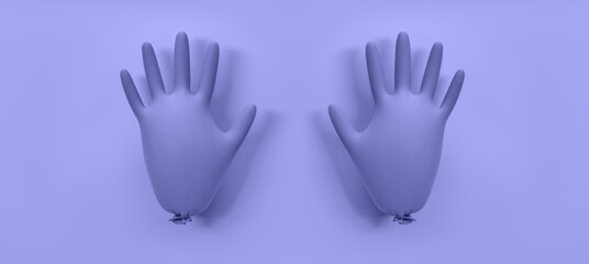 A pair inflated protective gloves on a violet background. Trendy color very peri in the 2022 year.