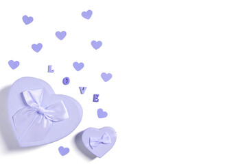 Violet gift boxes and confetti hearts isolated on white background. Color of the year 2022 Very Peri. Valentines day concept. Greeting card. Copy space, top view