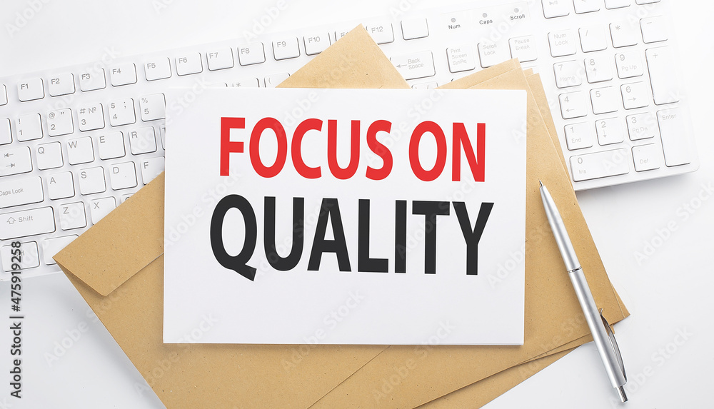 Poster text focus on quality on the envelope on the keyboard