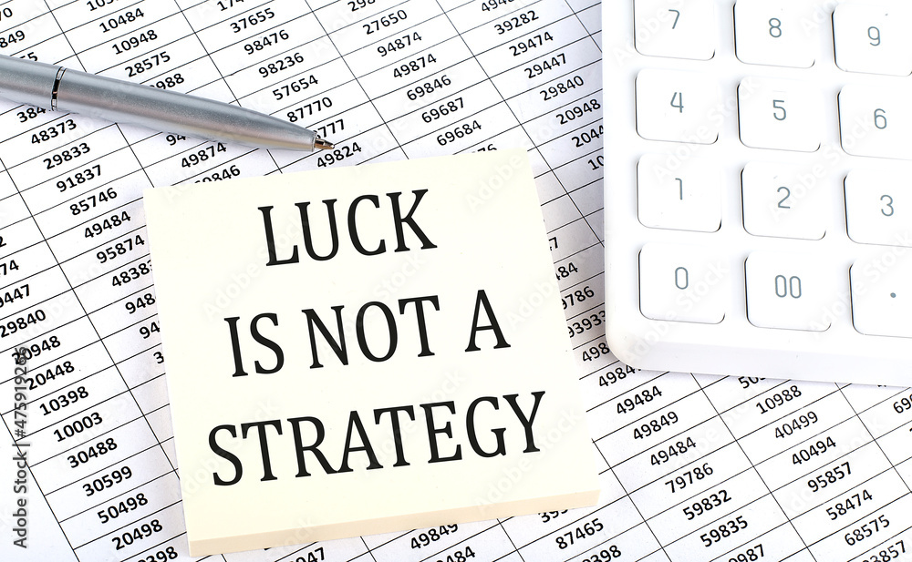 Poster luck is not a strategy- business concept, message on sticker on chart background
