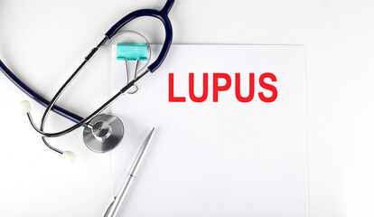 LUPUS text written on paper with a stethoscope. Medical concept.