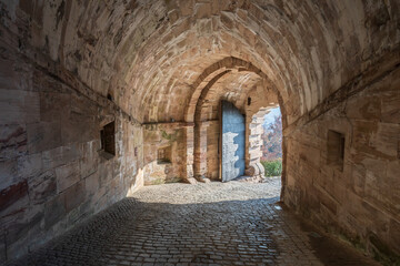 Fototapeta na wymiar Tunnel in the wall to the entrance of a castle
