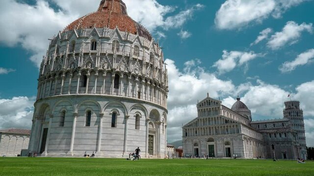 Pisa, Italy - December 10th 2021: Time lapse of Duomo and Tower of Pisa in Piazza dei Miracoli in Tuscany Italy. 4K Timelapse.