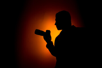 Silhouette man on red background.
