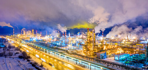 Aerial drone view of petrol industrial zone or oil refinery in Yaroslavl, Russia during winter at night. Banner wide format