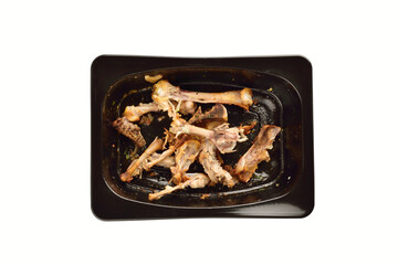 Leftover Chicken Bones in Container Isolated on White Background with Clipping Path