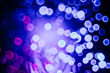 sparkling abstract bokeh background neon color with glitter circles defocused particles on dark background for overlay screen. Abstract Festive lights defocused.