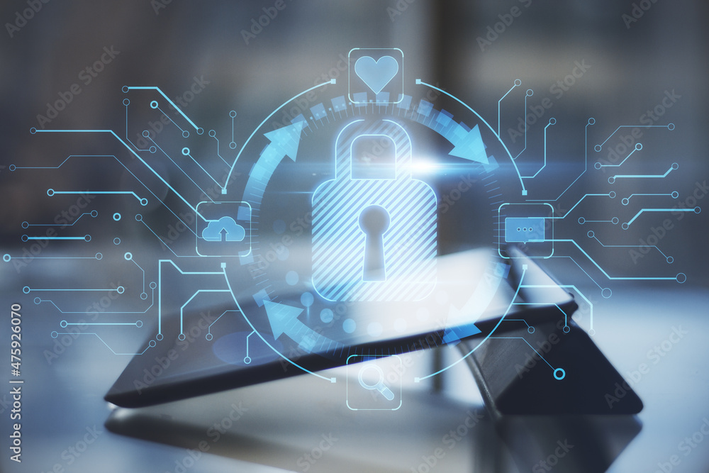 Poster close up of tablet on desktop with abstract glowing blue padlock hologram on blurry background. inte