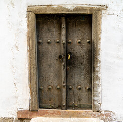 Uzbekistan, old wooden doors in the historical center of Bukhara.