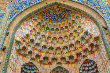 Uzbekistan, city of Bukhara,  rich decorated entrance of the Abdulaziz Khan Madrasah. 