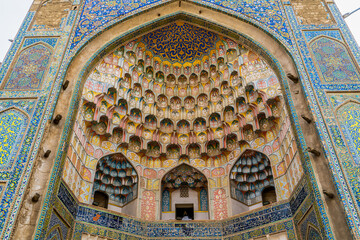 Uzbekistan, city of Bukhara,  rich decorated entrance of the Abdulaziz Khan Madrasah. 