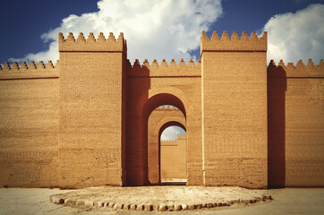 Great walls of Babylon under the sunlight and a blue cloudy sky