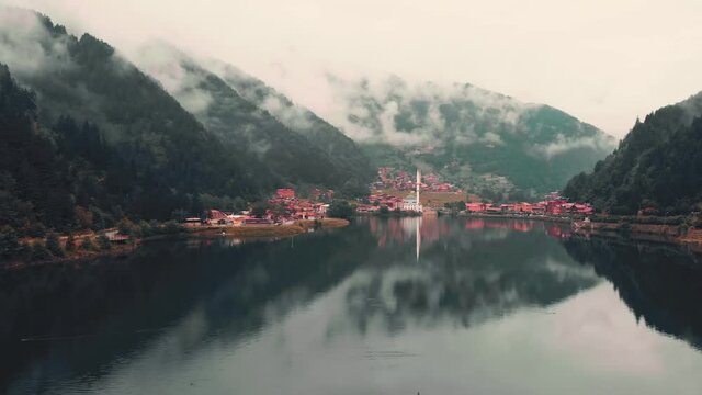 Fly over beautiful lake in Uzungol misty mountains village, Trabzon, Turkey