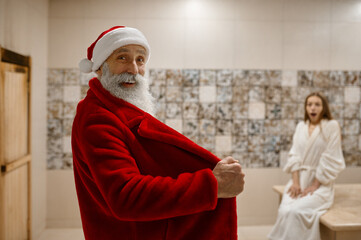 Bad Santa scared woman with open bathrobe