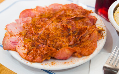 Image of tasty slices of lacon galician boiled pig ham served at plate