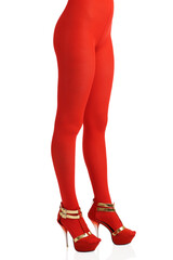 Side view of female legs in red nylon tights and red heels