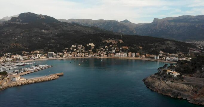 An aerial drone shot of the city coast of Port de Soler, Mallorca, Spain in 4K