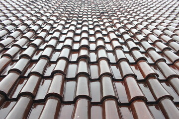 Glossy brown roof tiles. Roof tiles background