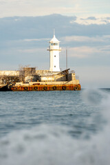 Fototapeta na wymiar Lighthouse on the sea coast in Yalta.