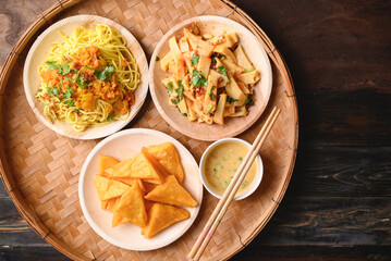 Deep fried Burmese tofu, spicy fresh Burmese tofu salad and noodles, Tai Yai food in Northern of Thailand, Table top view