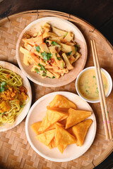 Deep fried Burmese tofu, spicy fresh Burmese tofu salad and noodles, Tai Yai food in Northern of Thailand, Table top view